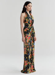 Woman wearing a floral gown on a white background