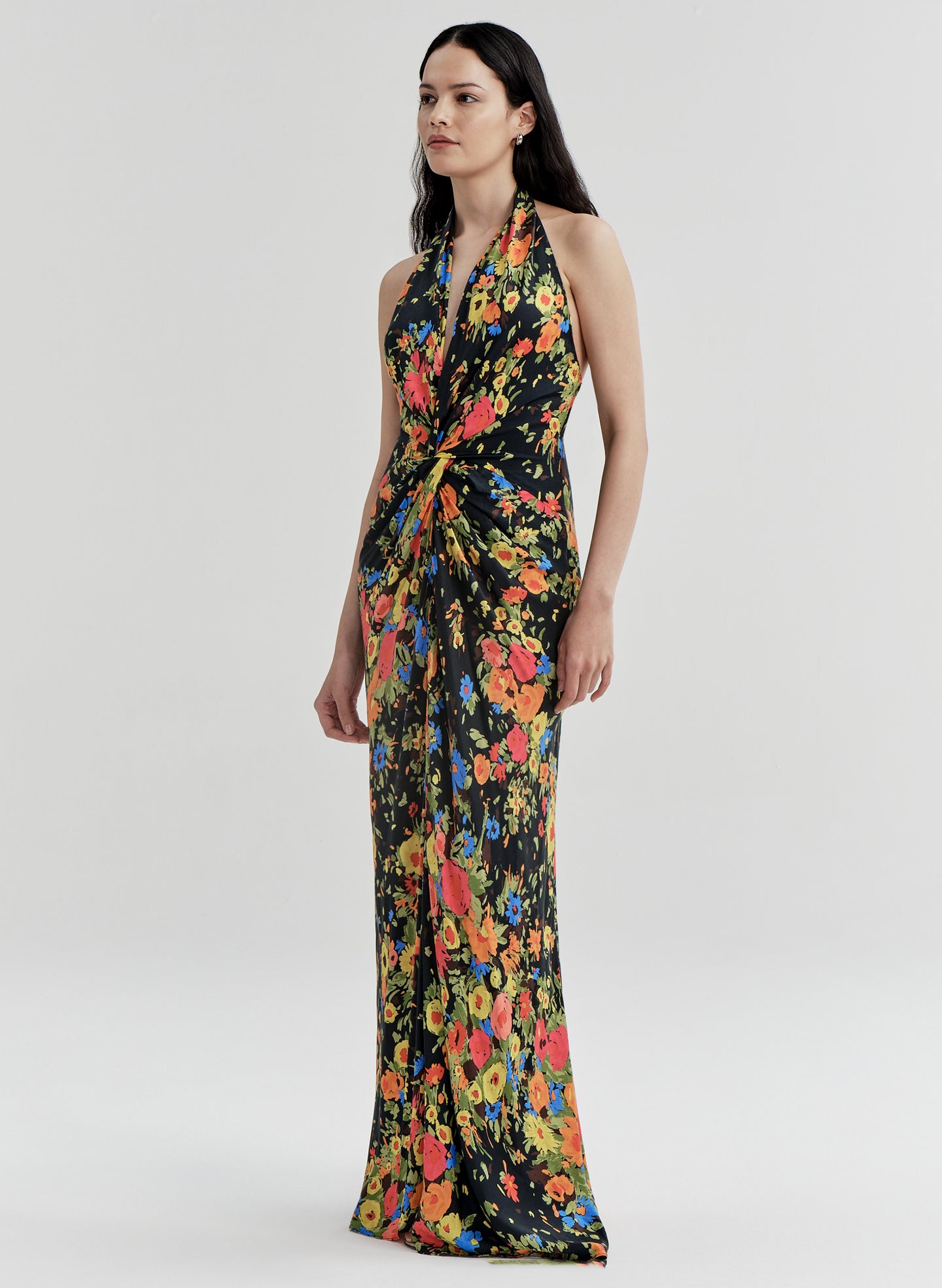 Woman wearing a floral gown on a white background