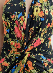 Close-up of a floral gown with a black background