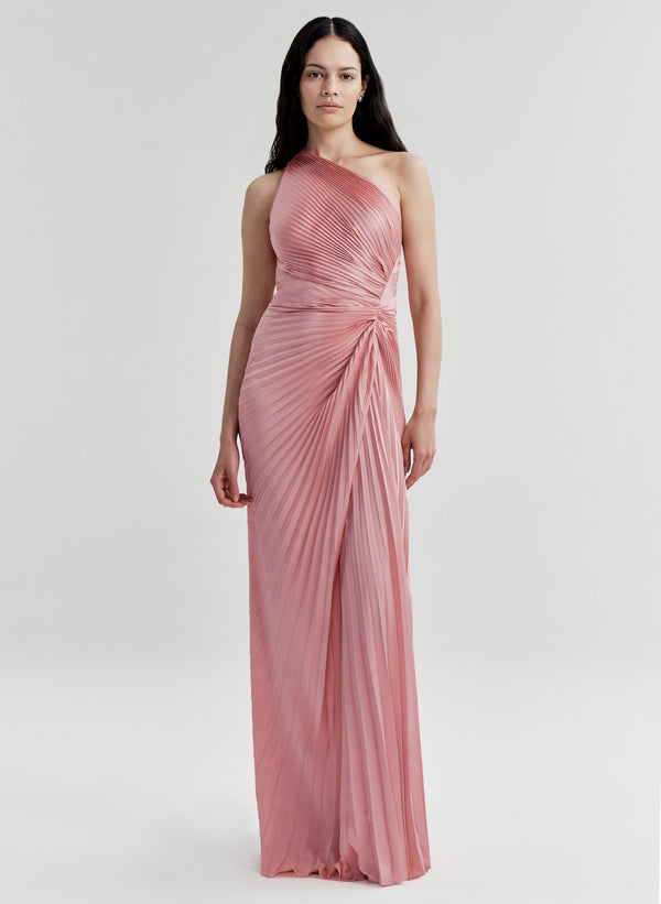 Woman wearing a pink one-shoulder gown on a white background