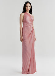 Woman wearing a pink one-shoulder gown on a white background