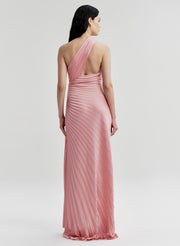 Woman wearing a pink pleated gown on a white background