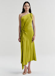 Woman wearing a green one-shoulder dress on a white background