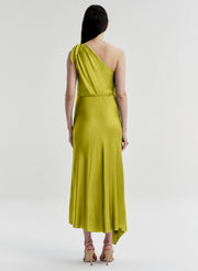 Woman wearing a green one-shoulder dress on a white background