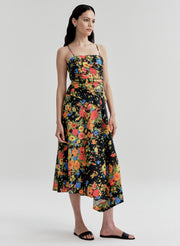 Woman wearing a colorful floral dress on a white background