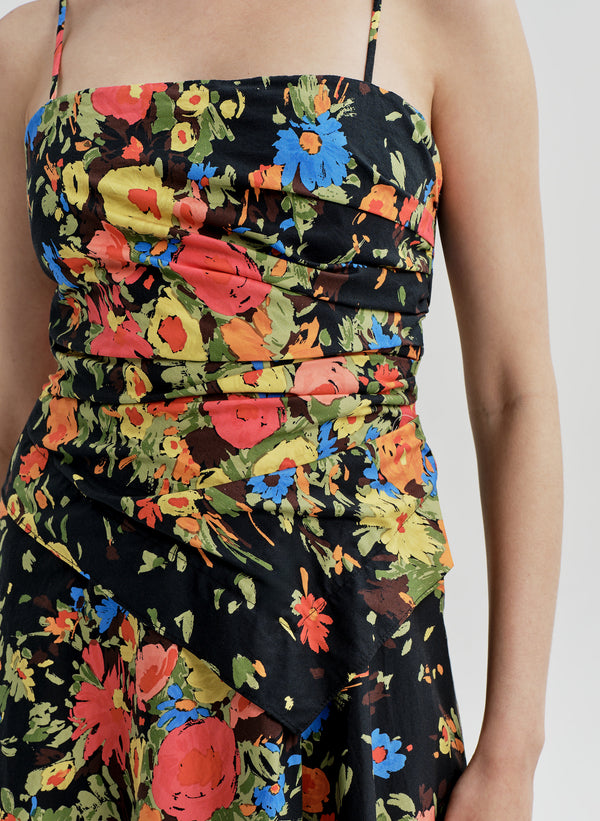 Woman wearing a colorful floral dress on a white background