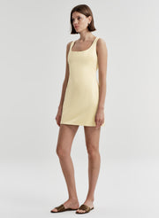 woman wearing yellow mini tank dress
