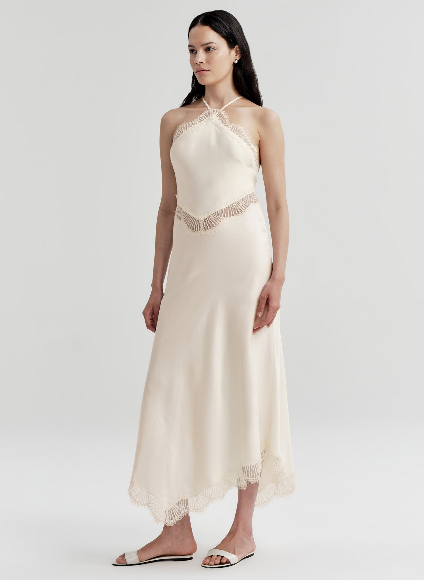 woman wearing white satin and lace midi dress