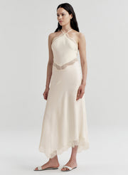 woman wearing white satin and lace midi dress