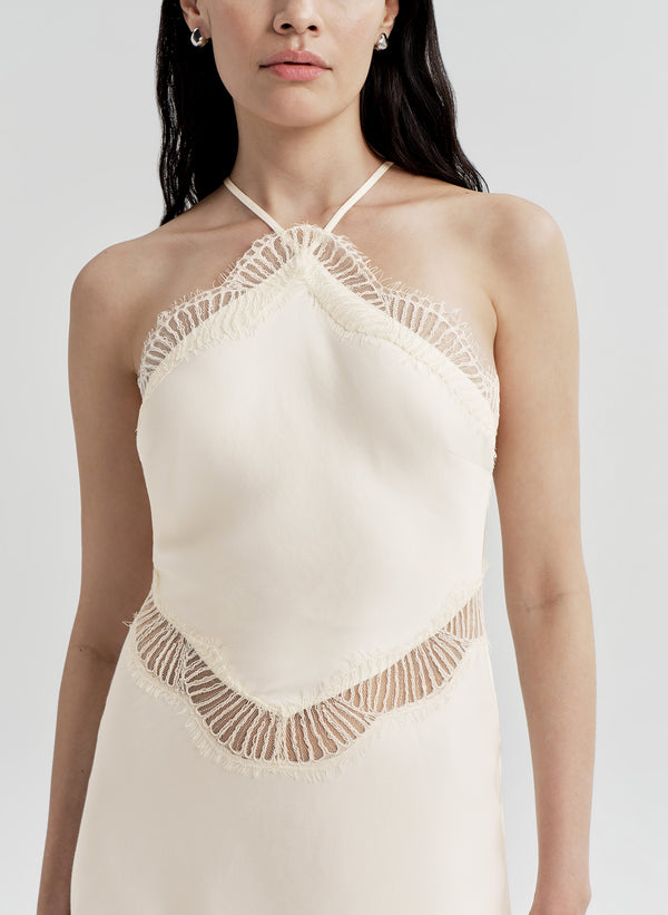 woman wearing white satin and lace midi dress