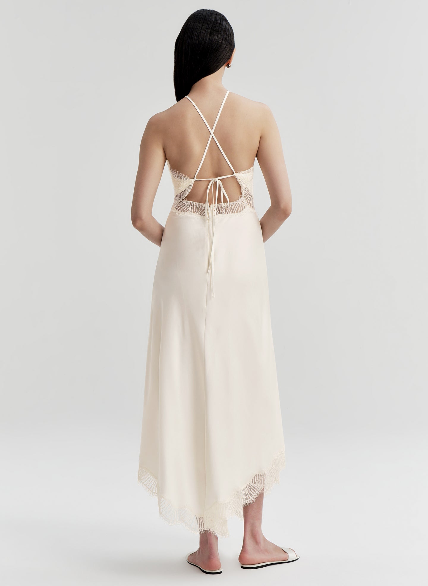 woman wearing white satin midi dress