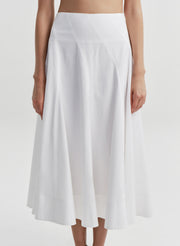 Woman wearing a white skirt on a white background