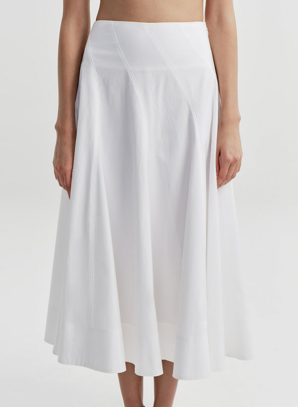 Woman wearing a white skirt on a white background