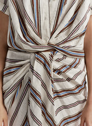 Close-up of a striped top and skirt with a knot detail