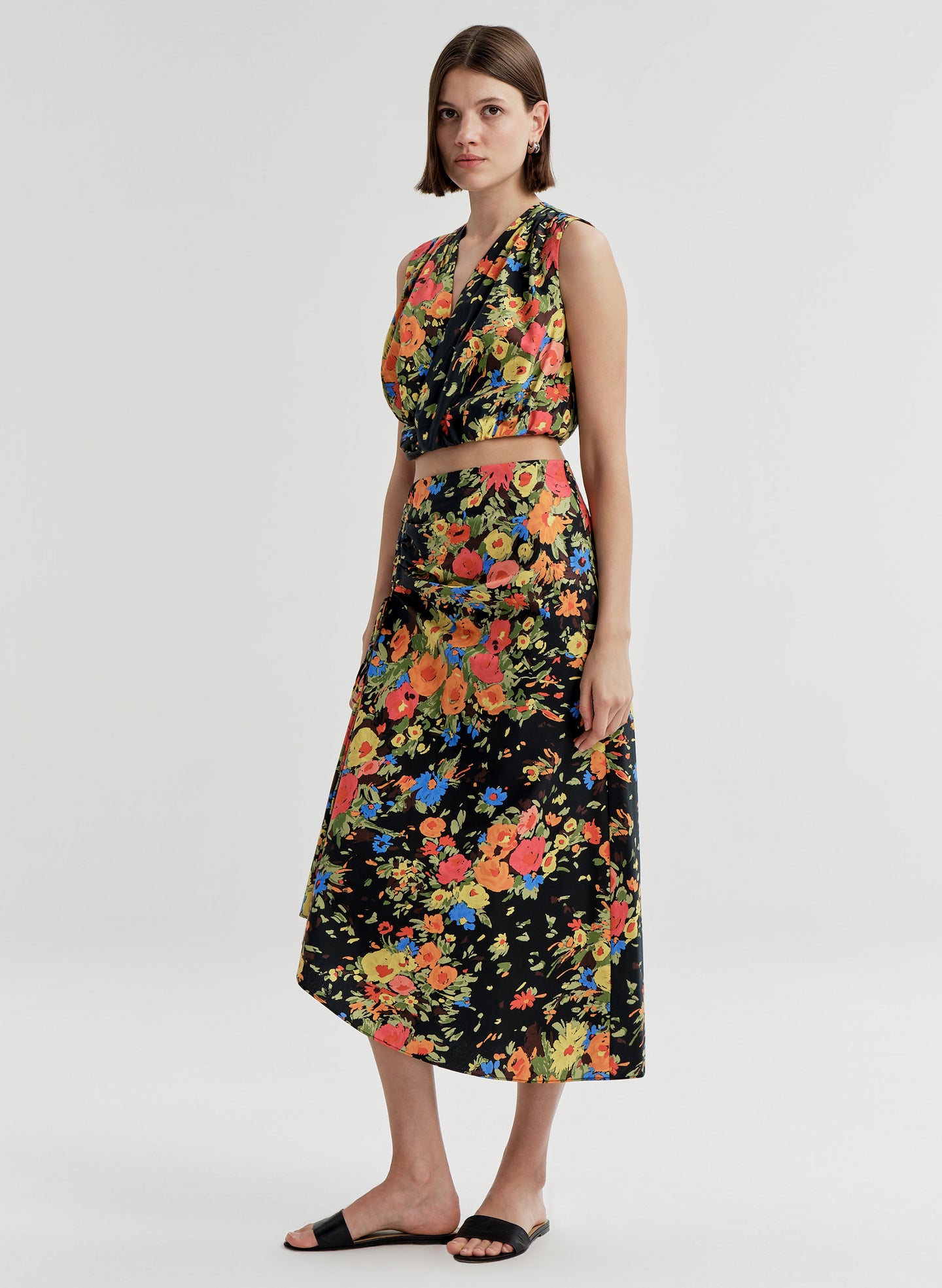 woman wearing floral shirt and skirt set