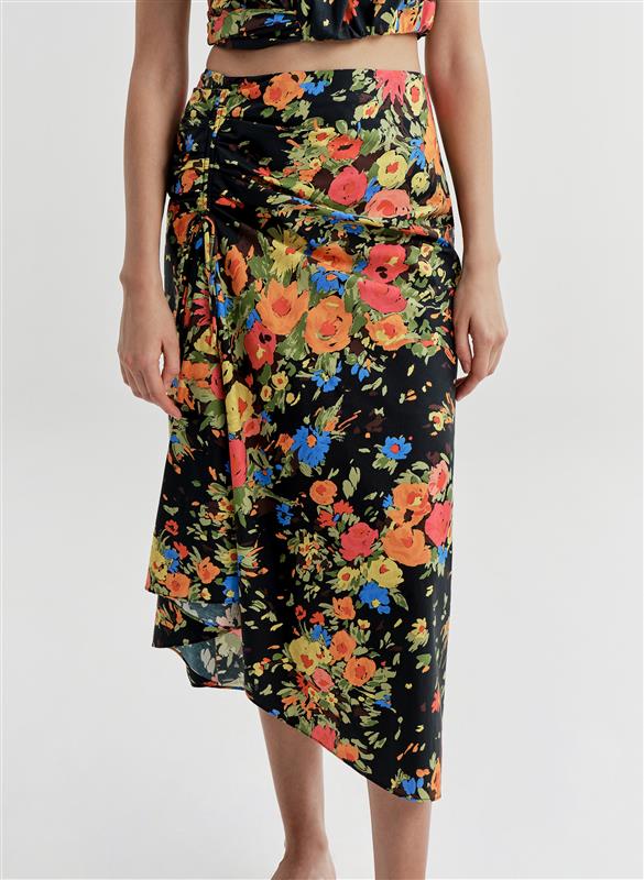 woman wearing floral shirt and skirt set
