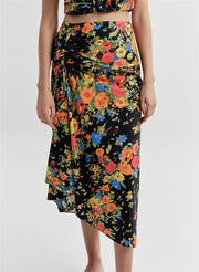 woman wearing floral shirt and skirt set