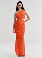 Woman wearing an orange skirt & matching top on a white background
