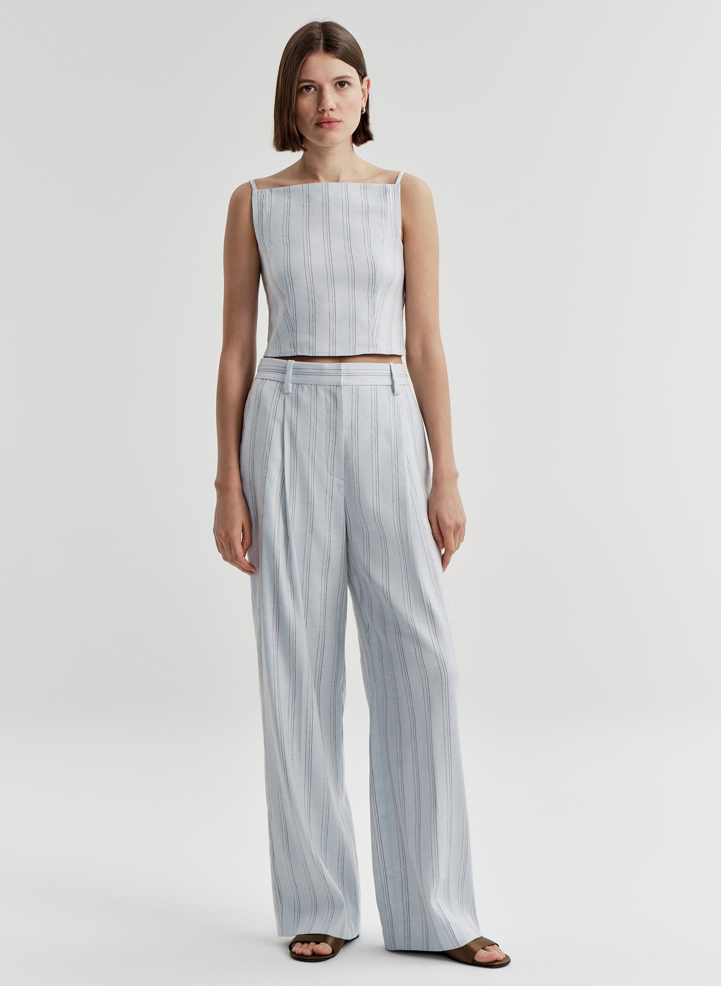 woman wearing blue striped linen set