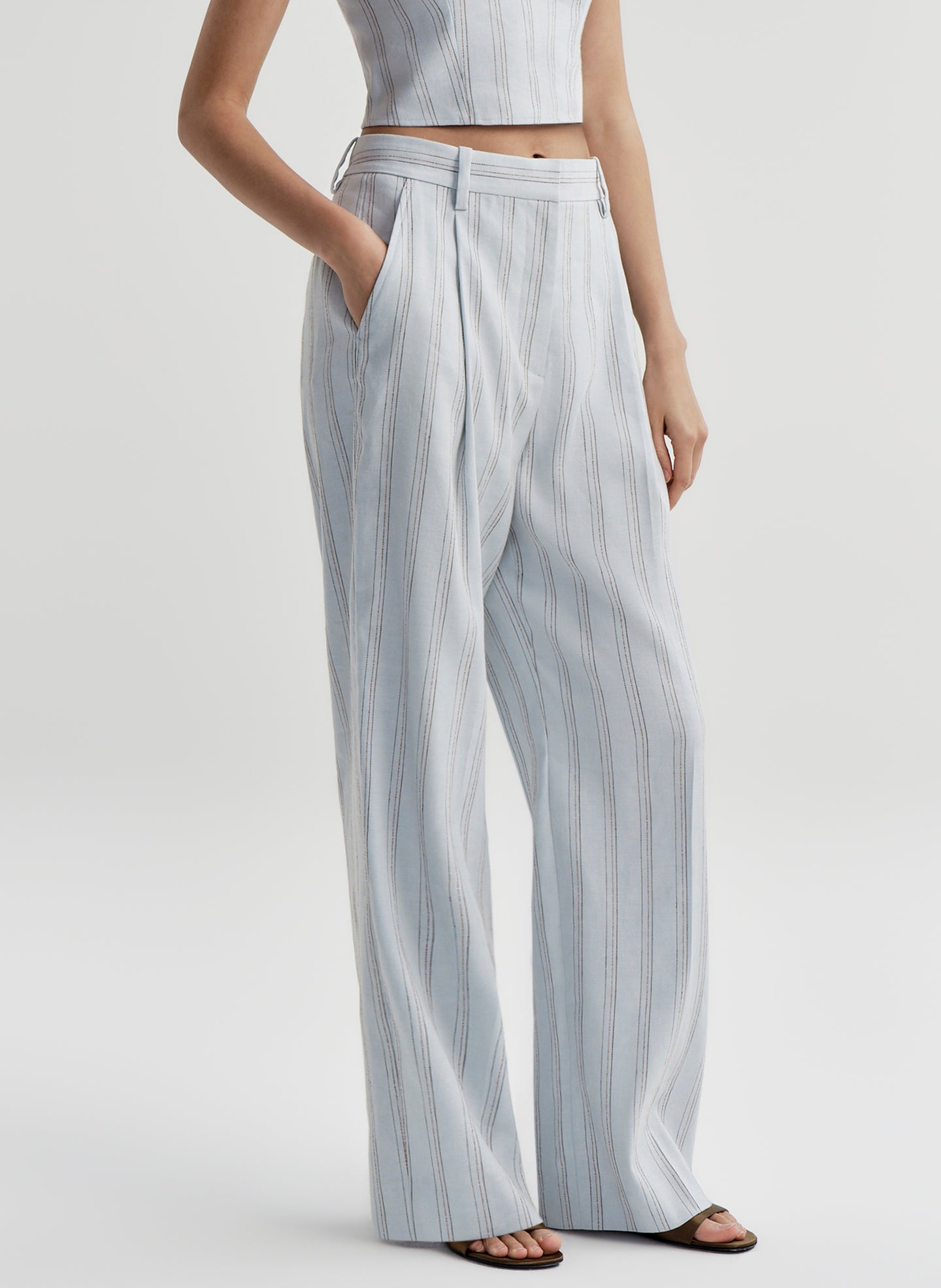woman in blue linen pants