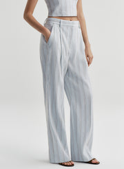 woman in blue linen pants