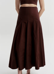 Woman wearing a brown skirt on a white background