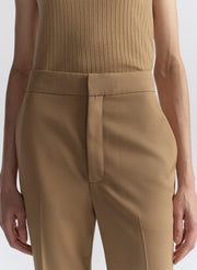 woman wearing tan sleeveless top and matching pants