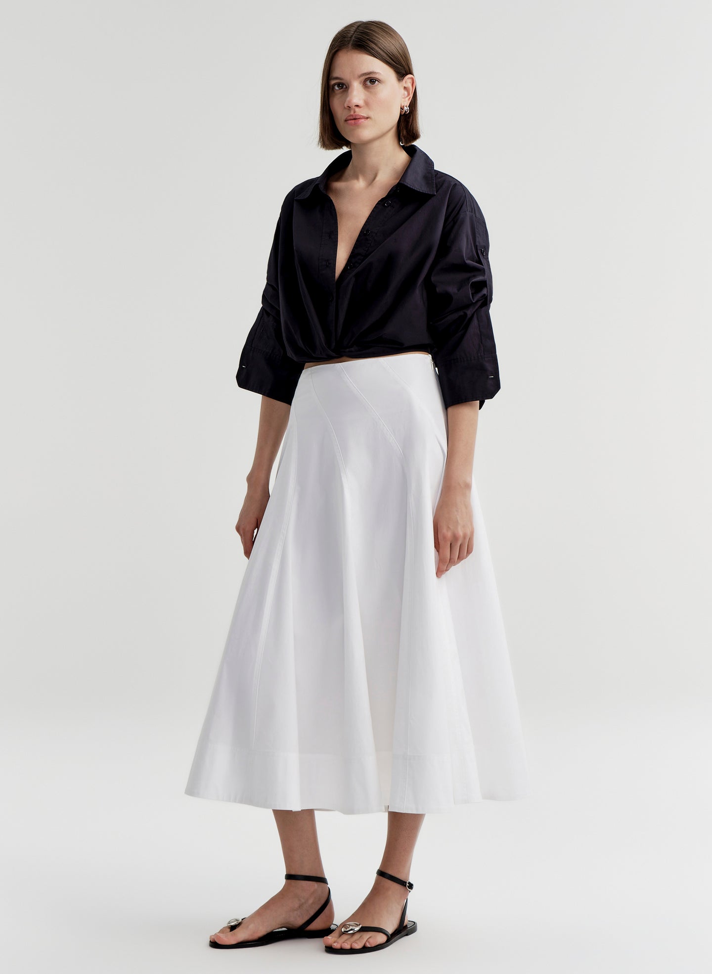 woman in blue shirt, white skirt