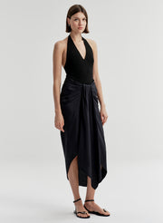 woman wearing black bodysuit and navy blue midi skirt