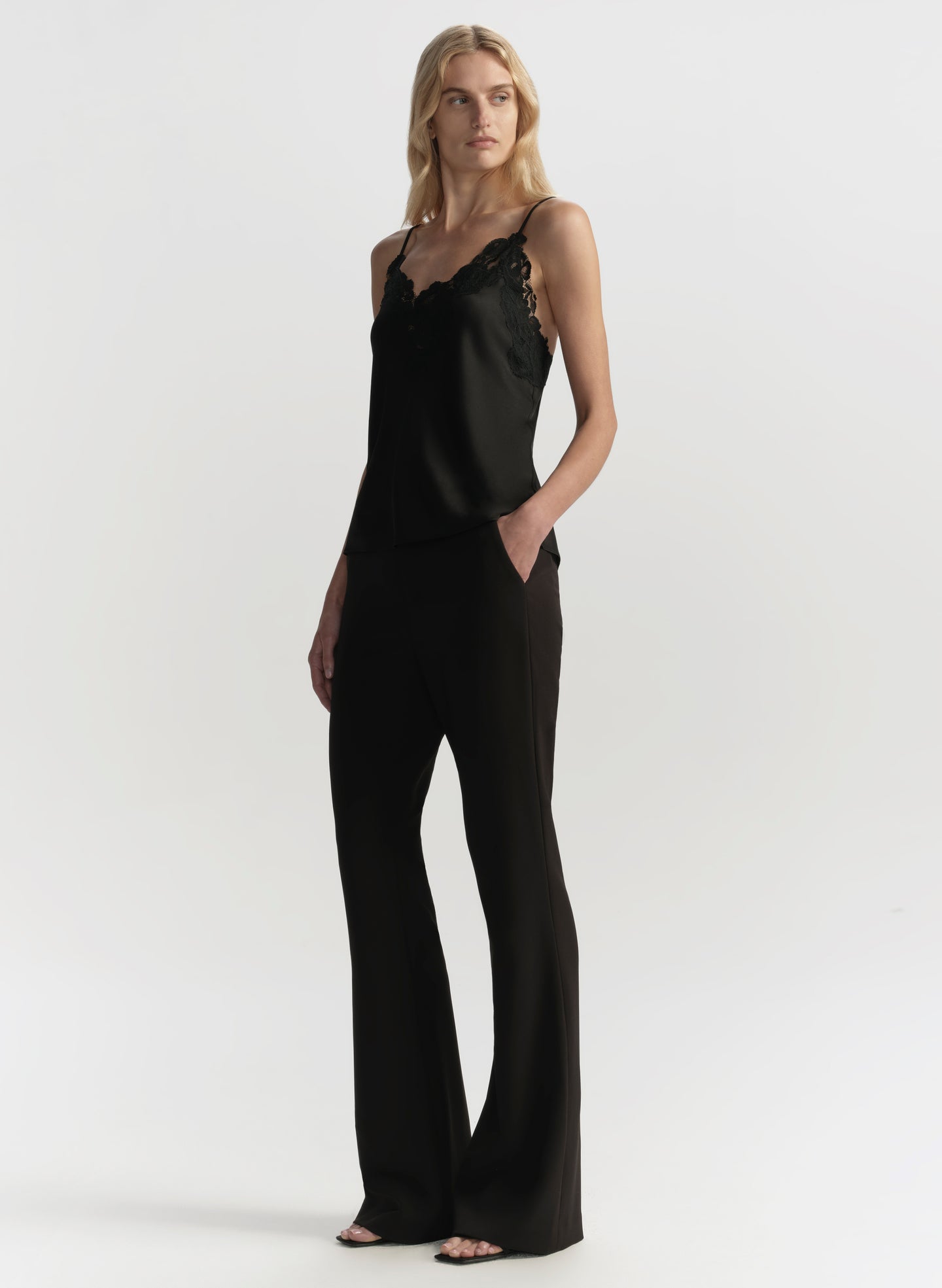 woman wearing black camisole top and black pants