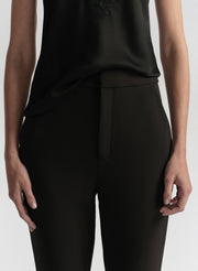 woman wearing black camisole top and black pants