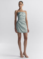 woman wearing light blue strapless mini dress