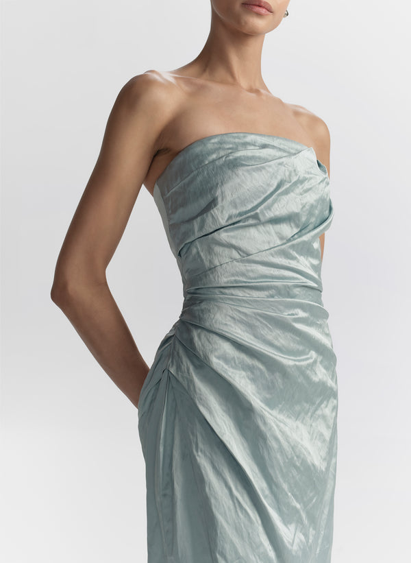 woman wearing light blue strapless mini dress