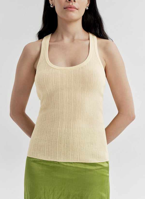 woman wearing yellow tank top and green midi skirt