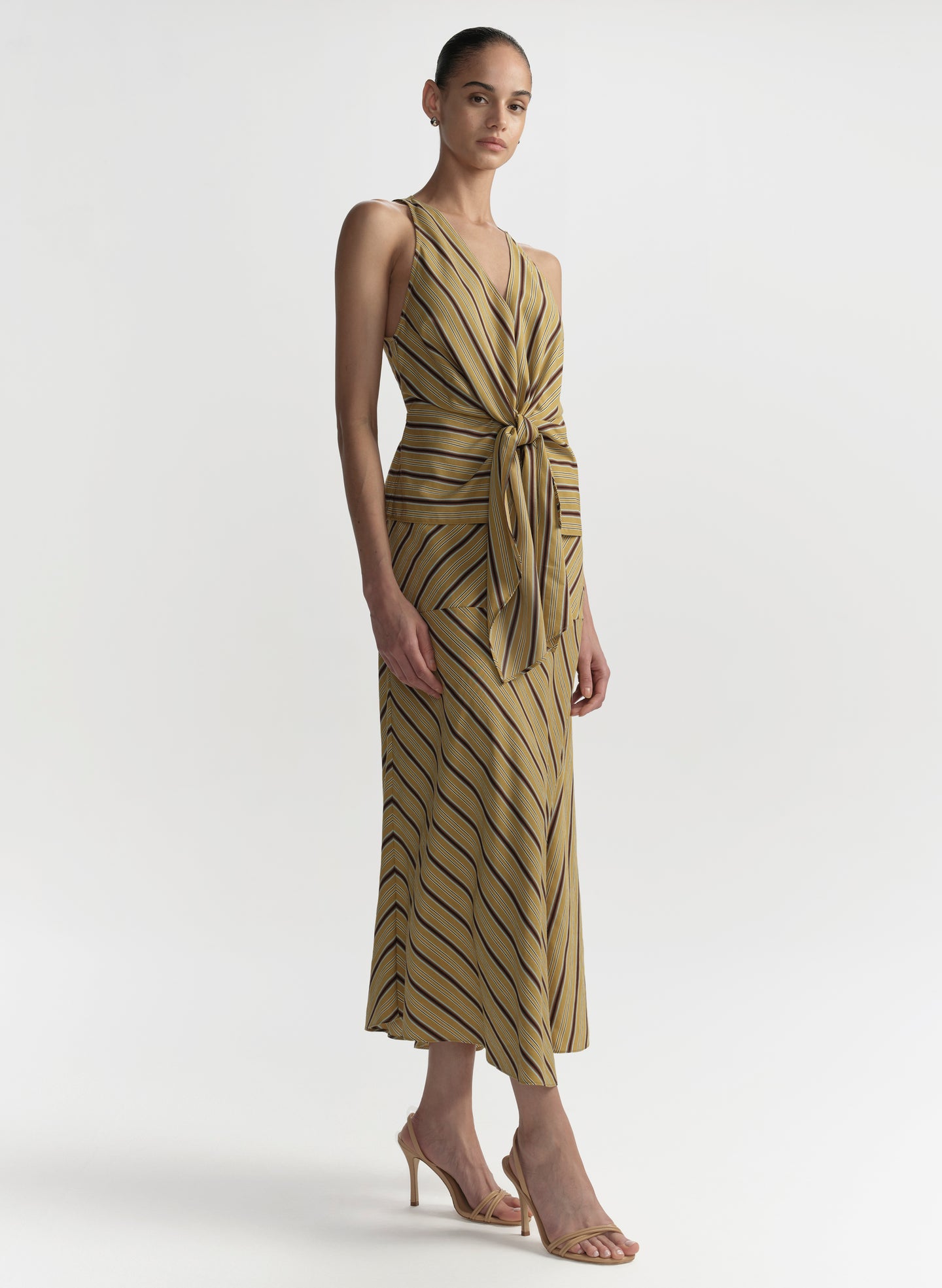 woman wearing striped top and matching skirt