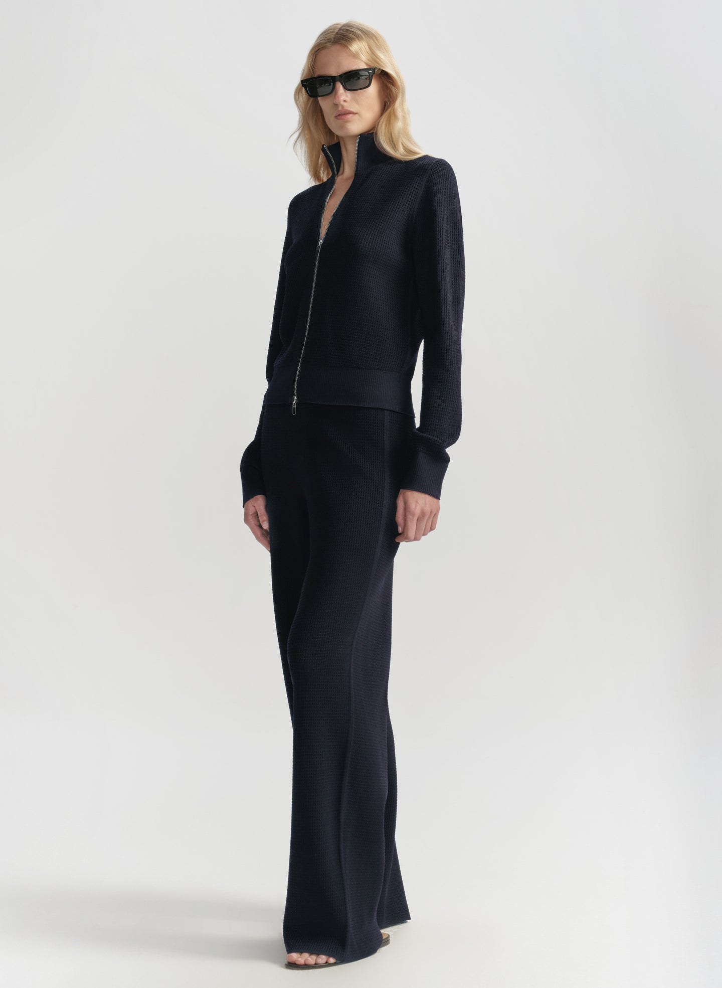 Woman wearing a blue outfit on a white background