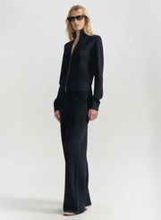 Woman wearing a blue outfit on a white background