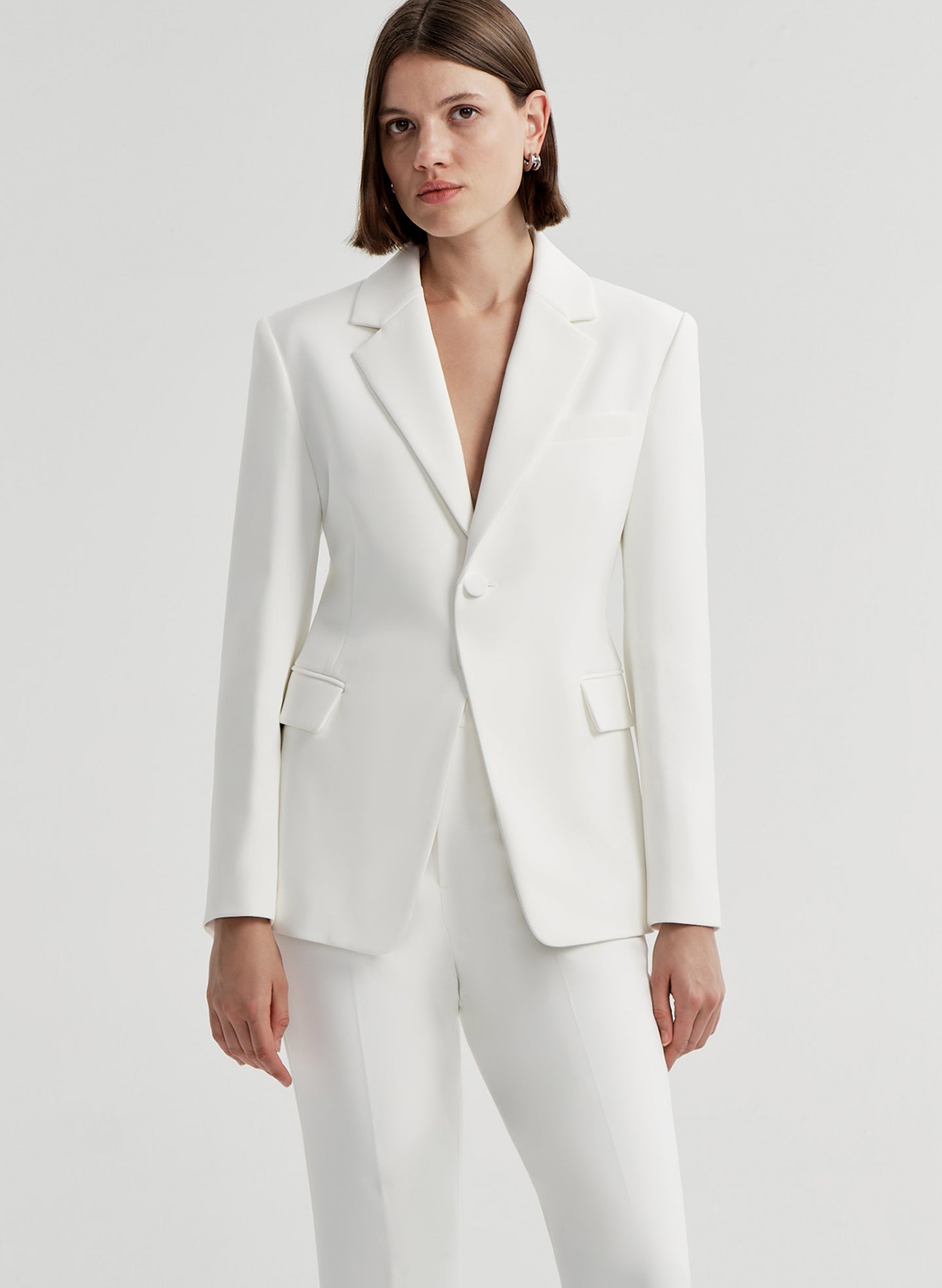 woman wearing white suit