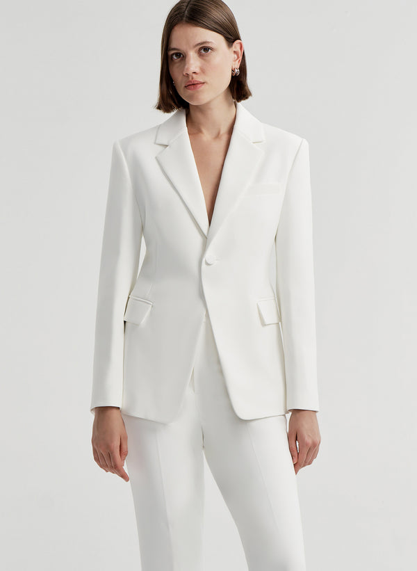woman wearing white suit