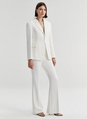 woman wearing white suit
