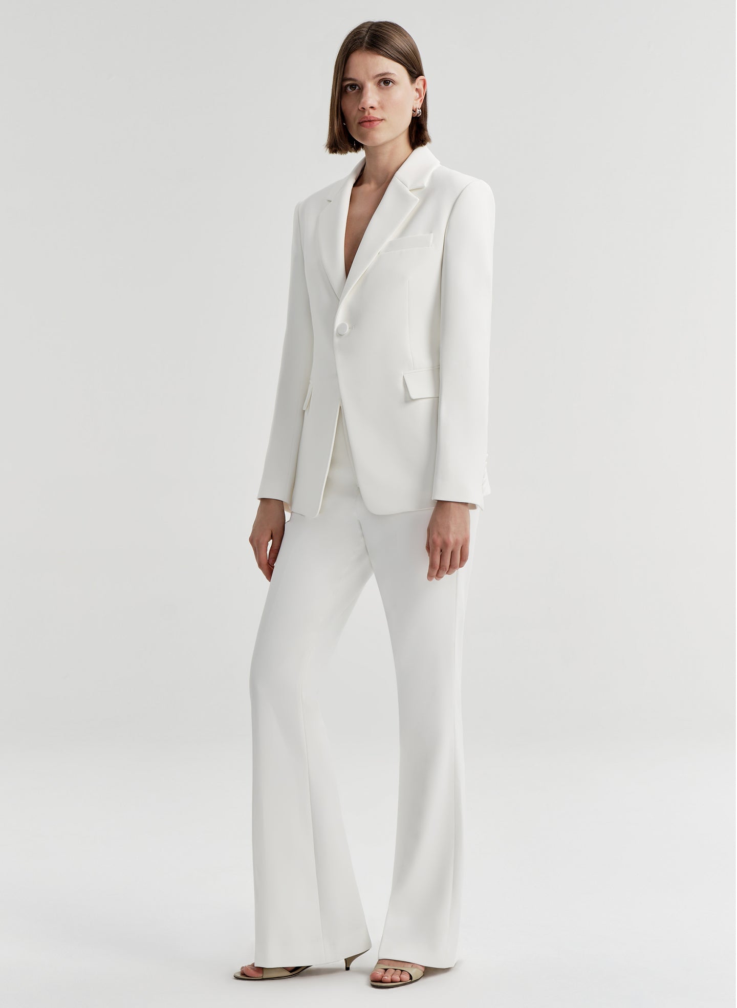 woman wearing white suit