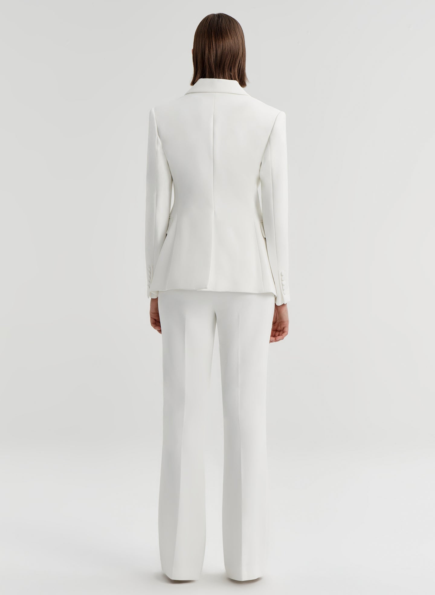woman wearing white suit