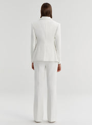 woman wearing white suit
