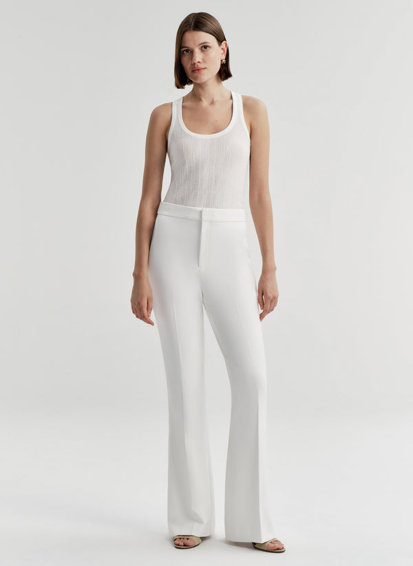 woman wearing white tank top and white pant