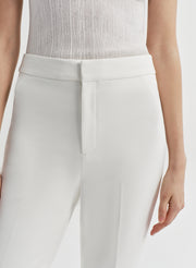 woman in white tank top and white pant