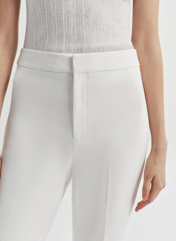woman in white tank top and white pant