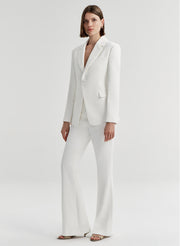 woman wearing white suit