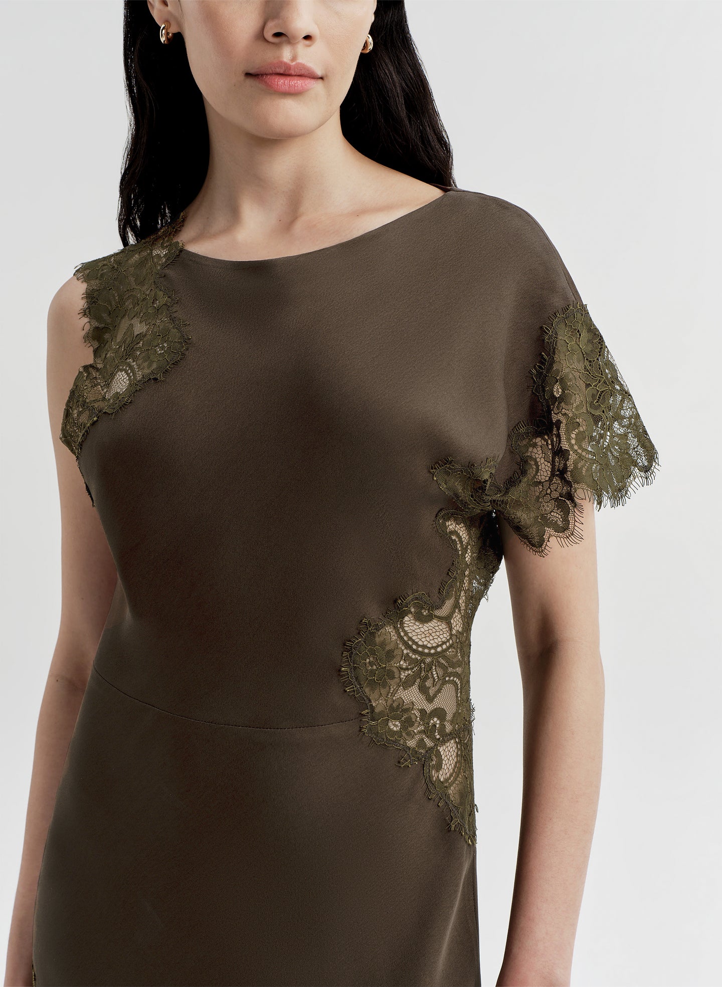 Brown dress with lace details on a white background