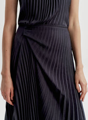 Dark pleated dress on a white background
