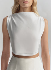 woman wearing white sleeveless top